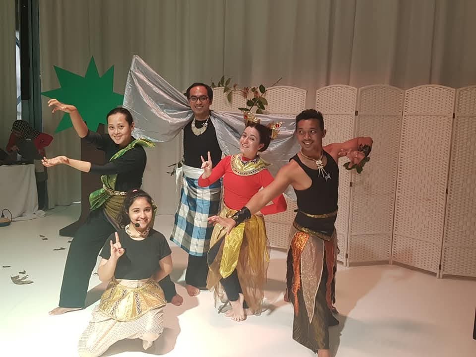 An ensemble of performers creating a story together
